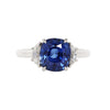 4.0 carat cushion cut blue sapphire center gemstone flanked by two half-moon diamonds in a platinum setting