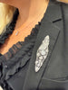Edwardian navette-shaped brooch with 9 European-cut bezel  diamonds and delicate openwork. on model