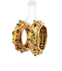 Pair of domed textured closed hoop earrings with round emerald cabochons. Side view