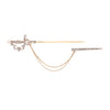 Opwn view of antique gold sword pin featuring round diamonds, pearl terminals, and decorative chain draping.