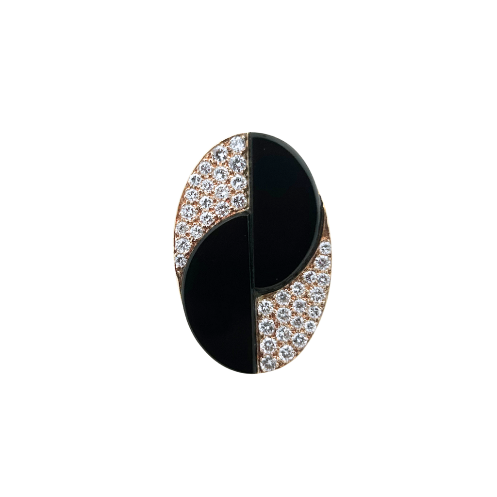 Top view of an oval black onyx ring accented with pavé-set round brilliant diamonds in polished 18k yellow gold.