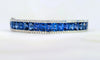 Estate hinged sapphire baguette bangle bracelet in 18k white gold. Side view