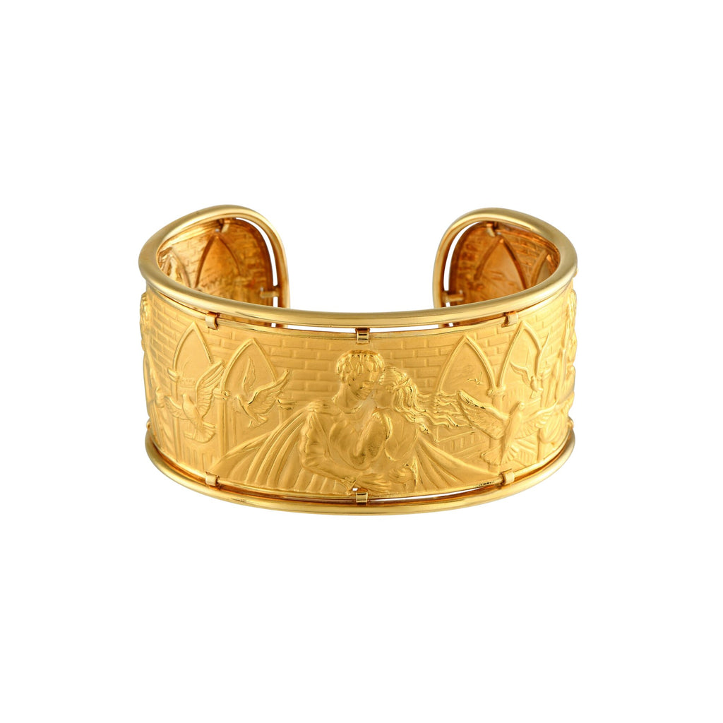 Front view of wide Carrera y Carrera gold cuff with sculpted Romeo and Juliet scene, birds, and architectural details