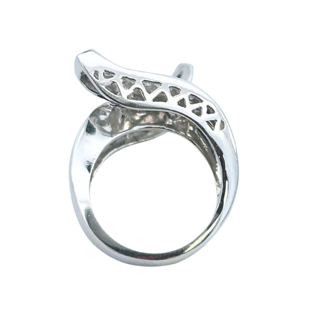 Side profile of 14K white gold diamond bypass ring showing elevated ends