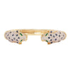 Front view of a luxury 18K yellow gold cuff bracelet with pavé diamond leopard heads, sapphire accents, and emerald eyes.