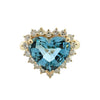 Heart-shaped aquamarine ring with diamond halo in yellow gold