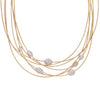 Marco Bicego 18K gold multi-strand necklace with 7 diamond pavé stations, 1.50 CTW, and a 16” shortest strand. Close up view.