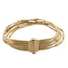 Side view of Marco Bicego’s 18k yellow gold Marrakech bracelet showing twisted gold strands and diamond accents.