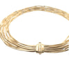 Detail view of Marrakech necklace clasp showing engraved gold strands by Marco Bicego.