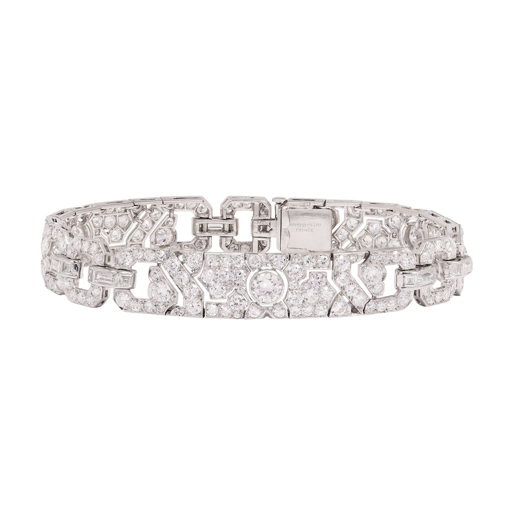 Front view of a MAUBOUSSIN Art Deco platinum bracelet set with mixed-cut diamonds in an architectural geometric design.