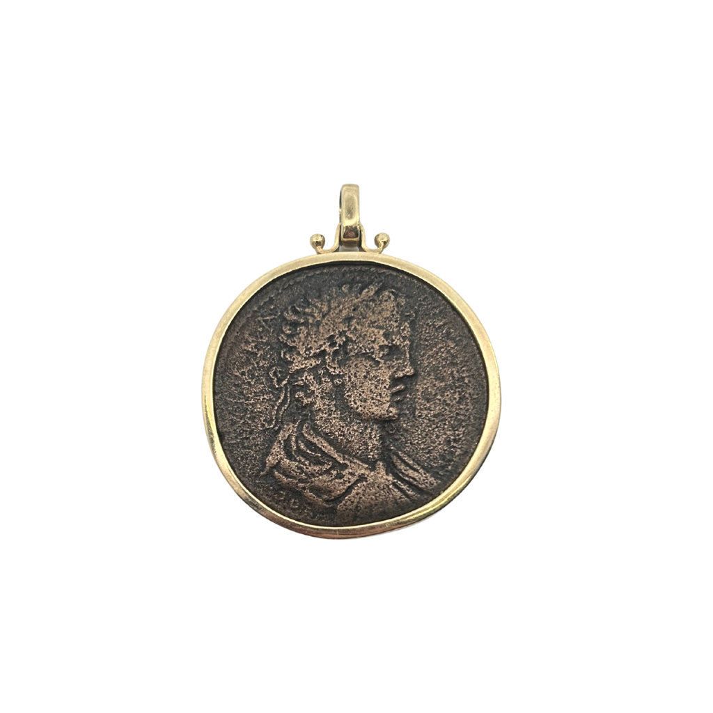 Obverse view of ancient Roman bronze coin pendant with profile bust in 14K gold bezel.