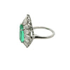 Side profile showing emerald ring basket setting with oval, marquise, and baguette diamonds.