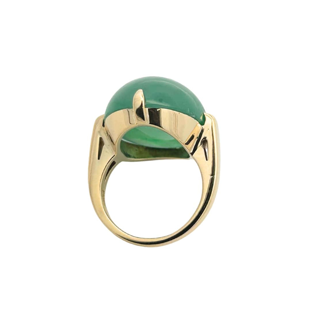 Side view highlighting the four-prong compass setting and sleek 18k yellow gold shank of this classic jade ring.
