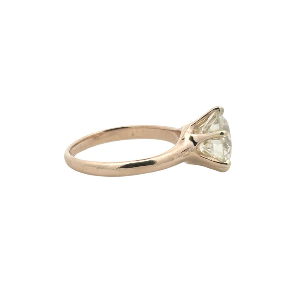 Side profile showing classic six-prong yellow gold mounting and antique diamond proportions