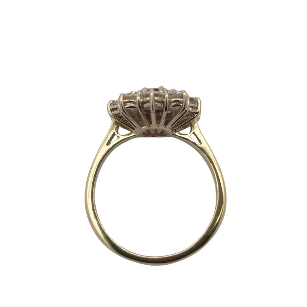 Side profile showing handcrafted wirework undergallery and prong-set ruby and diamonds
