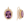 Elegant Victorian 14K gold wire hook earrings with oval amethysts, twisted gold detail, and a pearl frame. Side view.