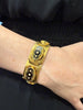Victorian 18K yellow gold black enamel bracelet with natural half pearls worn on wrist