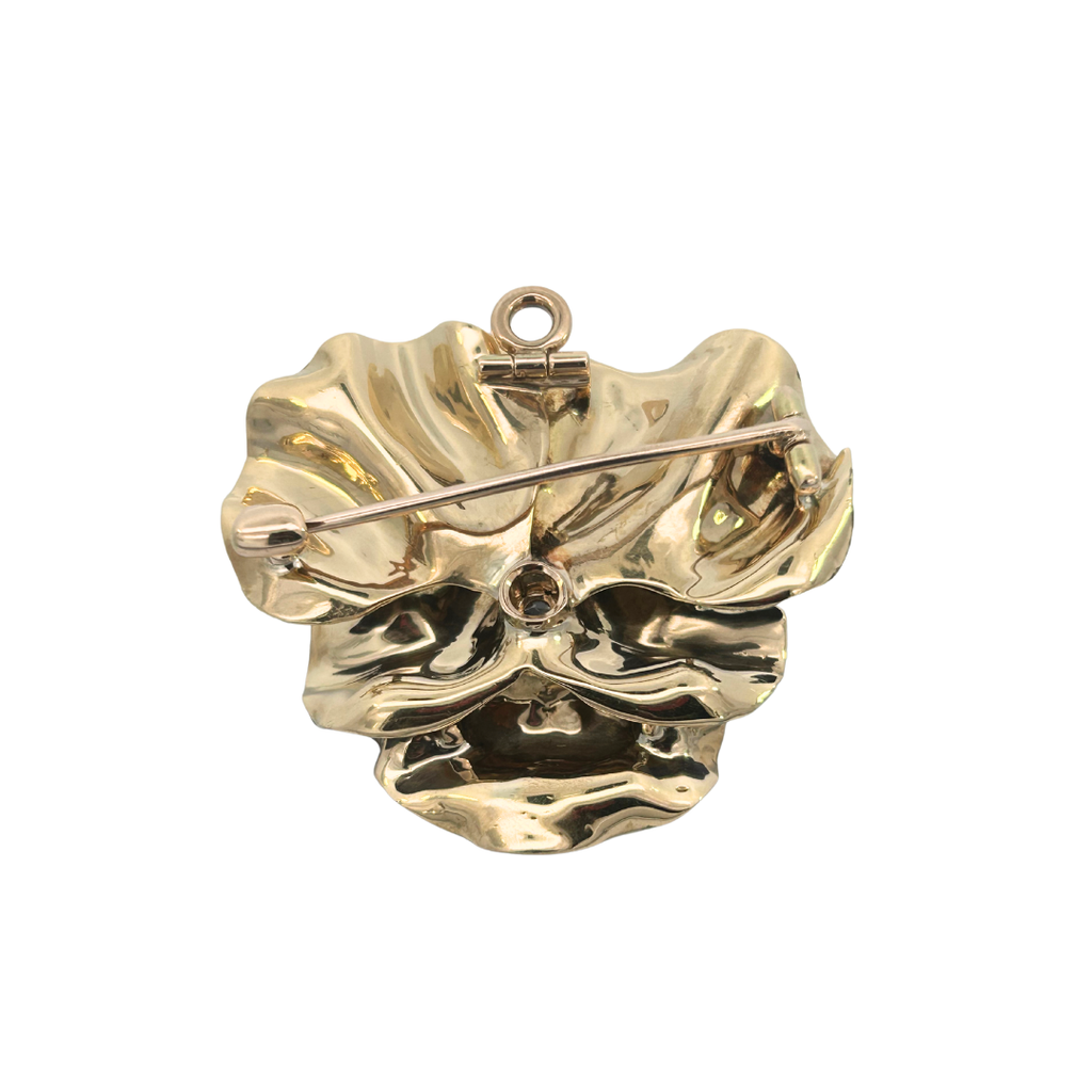 Back view of enamel pansy brooch showing pin mechanism and bail for pendant wear.