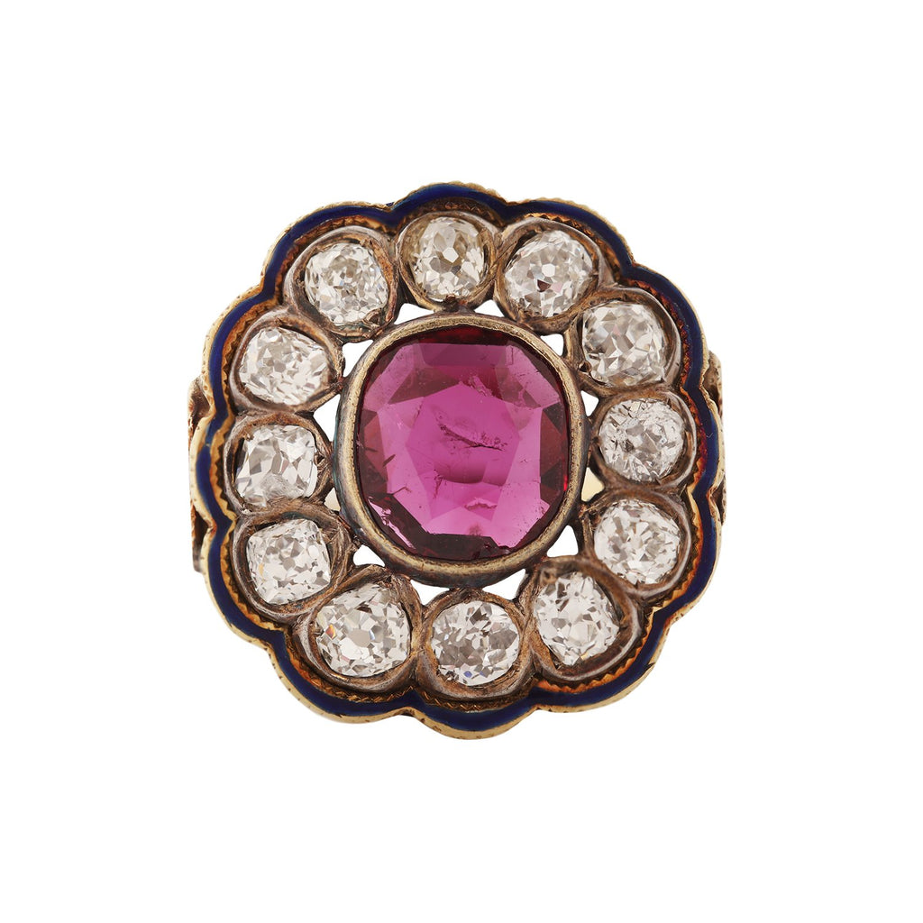 Victorian ring with bezel set ruby, bezel-set diamond clustered around the center stone and blue enamel around the border. Front view.