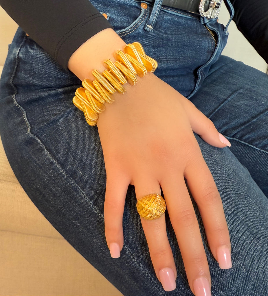 Vintage Cartier 18K yellow gold triangular link bracelet with Florentine finish worn on model