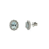 Aquamarine and diamond halo stud earrings showing 14k white gold scalloped setting.