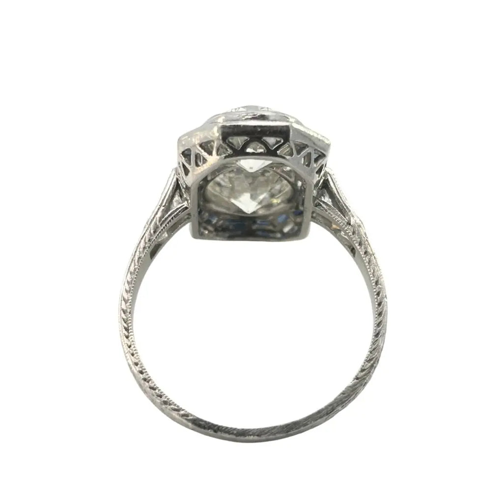 North–south Art Deco diamond and sapphire plaque ring in platinum with openwork gallery and engraved shank