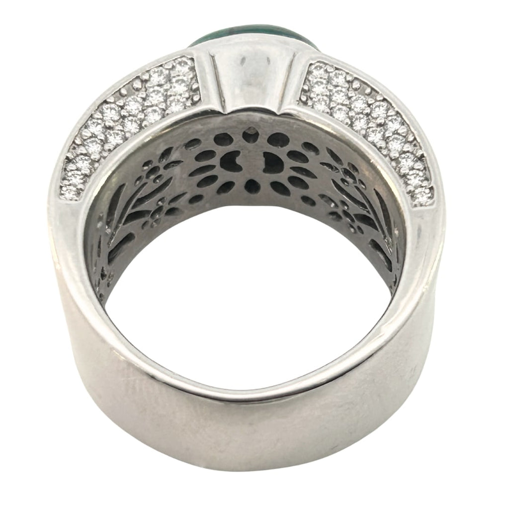 Contemporary wide band ring set with a 4.04ct Colombian trapiche emerald and 1.74ct pavé diamonds.