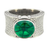 Contemporary wide band ring set with a 4.04ct Colombian trapiche emerald and 1.74ct pavé diamonds.