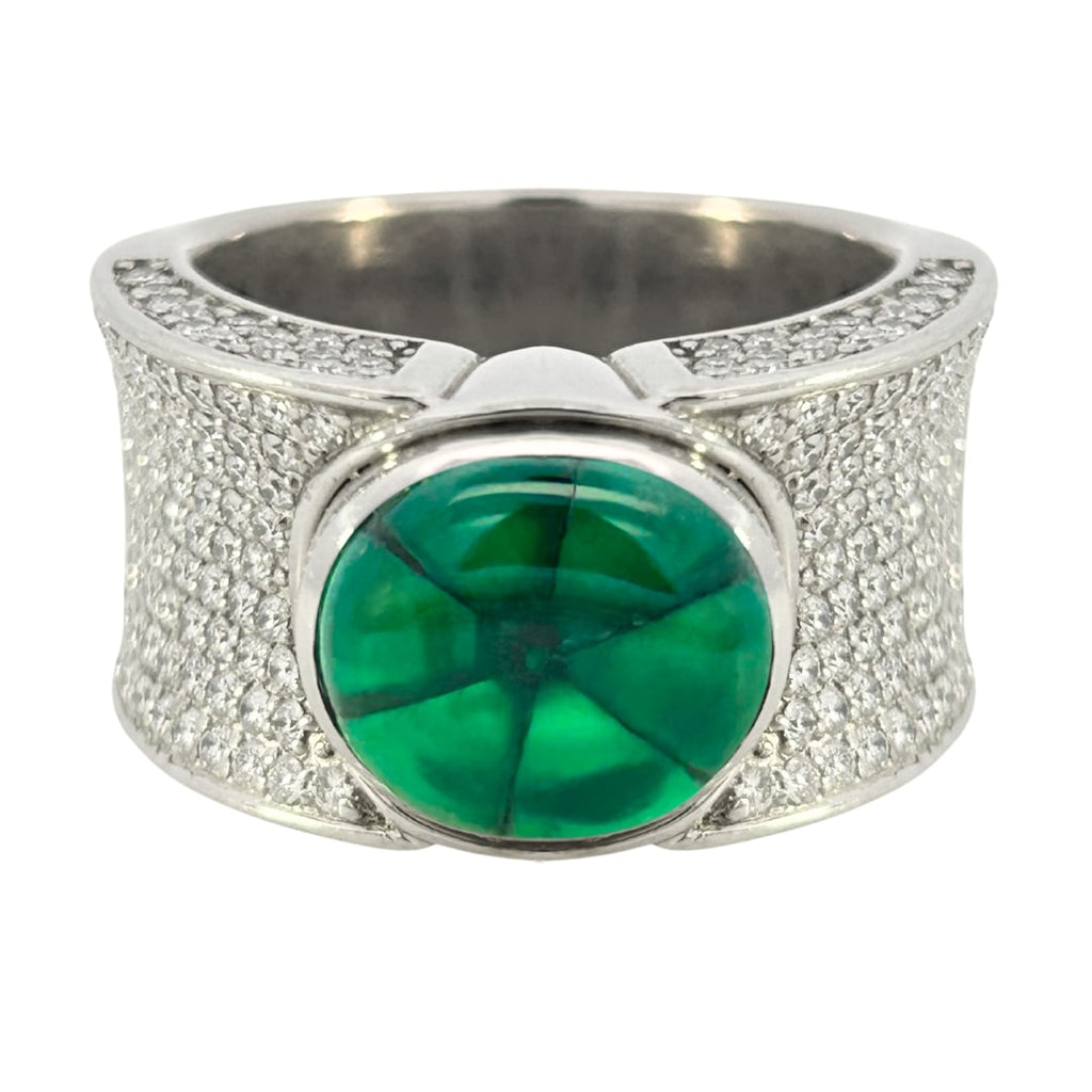 Contemporary wide band ring set with a 4.04ct Colombian trapiche emerald and 1.74ct pavé diamonds.