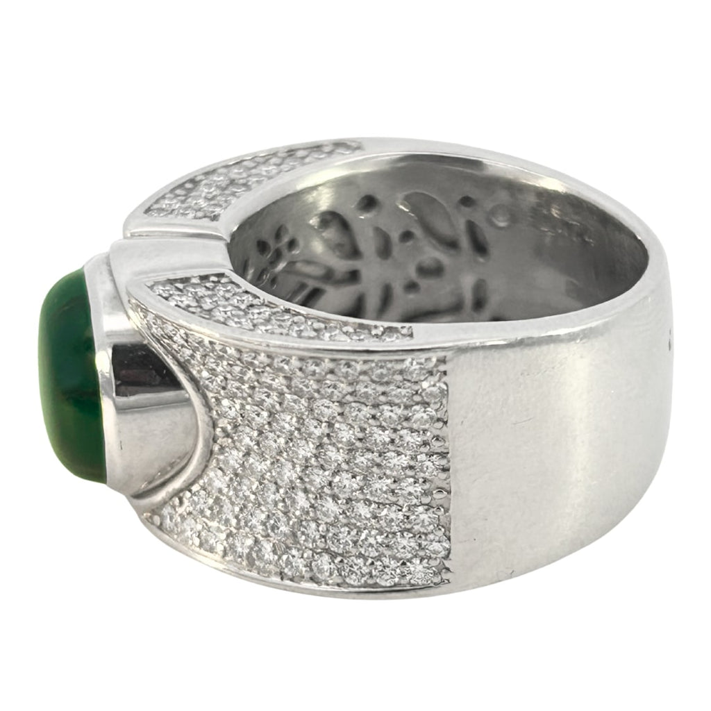 Contemporary wide band ring set with a 4.04ct Colombian trapiche emerald and 1.74ct pavé diamonds.