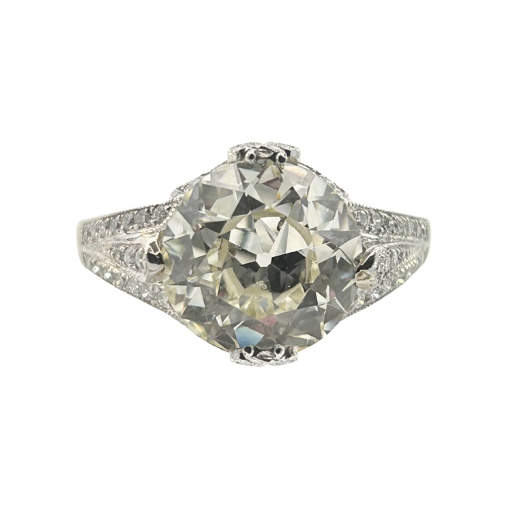 Platinum ring featuring a 3.67ct old European–cut diamond with compass-set prongs and pavé shoulders