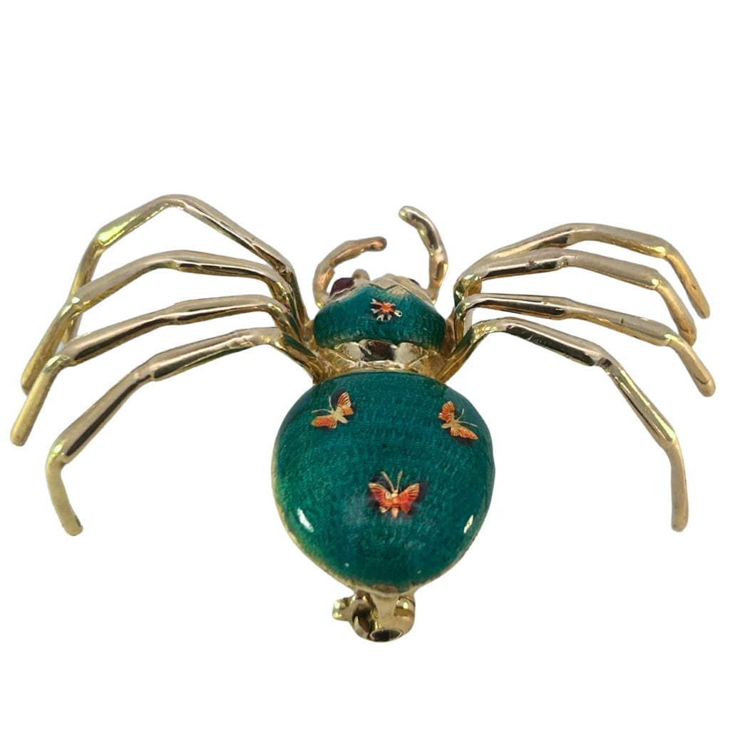 Back view of the spider brooch revealing the segmented enamel abdomen and engraved butterflies.