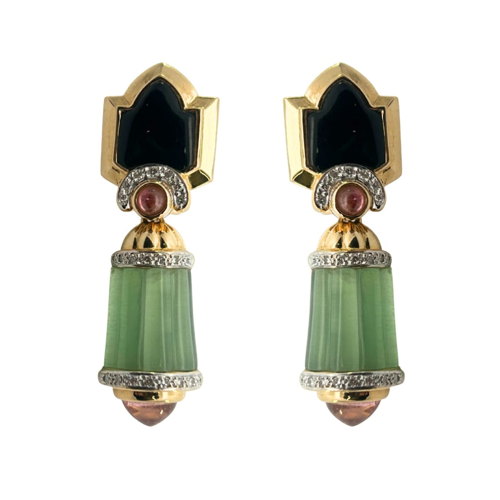 Front view of 18k yellow gold drop earrings with black onyx ogee tops, pink tourmaline cabochons, diamond collars, and fluted green tourmaline drops.