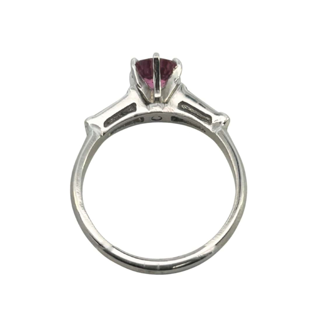platinum ring with 0.84ct round pink sapphire flanked by tapered baguette diamonds totaling ~0.30ct.
