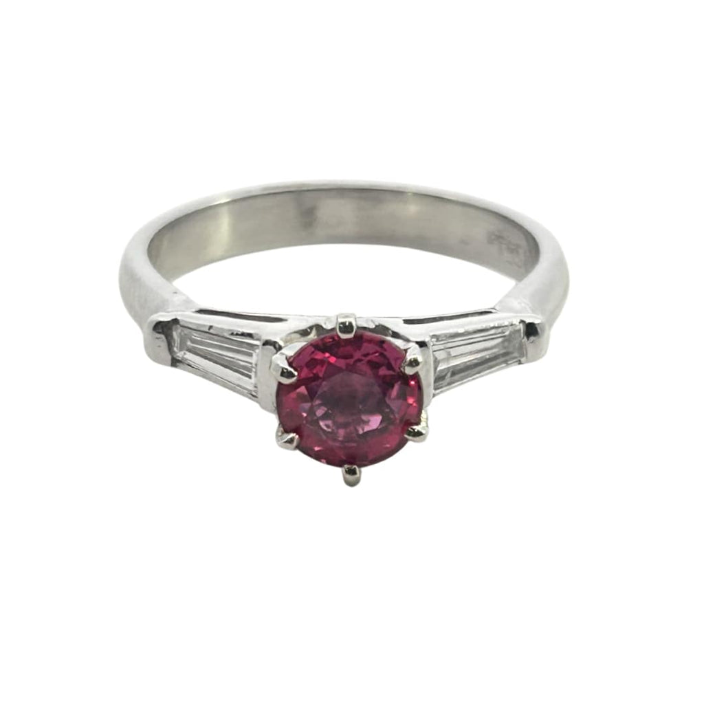 Vintage platinum ring with 0.84ct round pink sapphire flanked by tapered baguette diamonds totaling ~0.30ct.