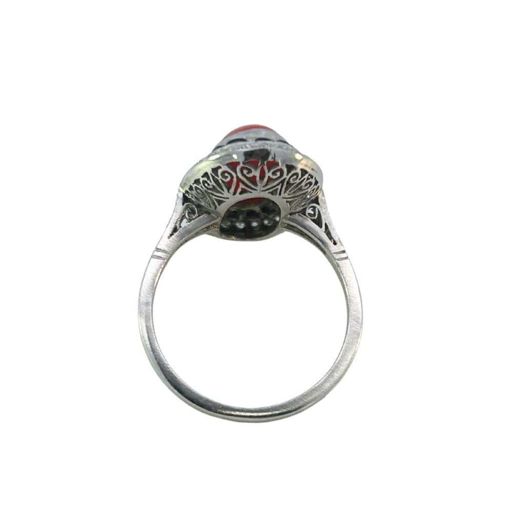 Back and side view of the platinum ring showing the ornate filigree under-gallery work and raised setting.