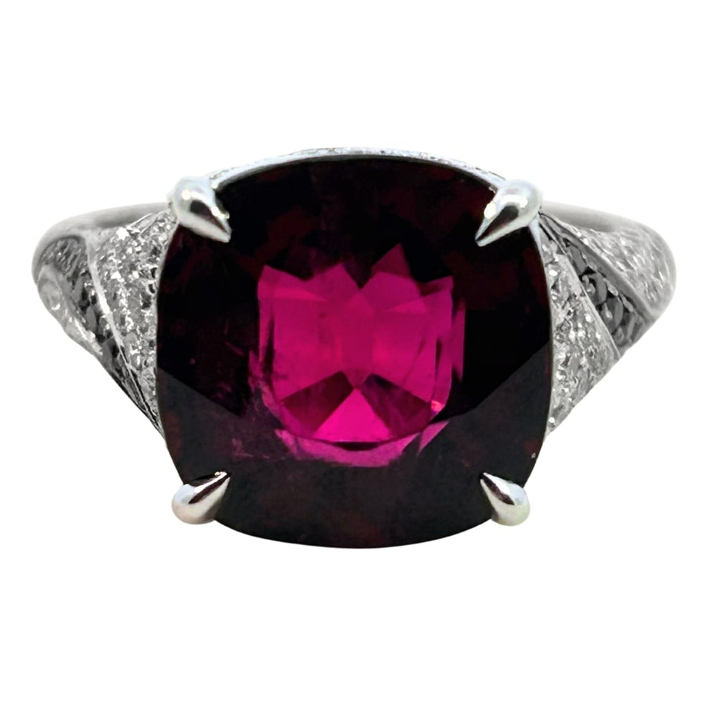 18k white gold rubellite and diamond cocktail ring with black diamond swirl accents and 5.35ct cushion-cut rubellite center.