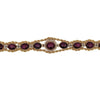 Flat view of the star ruby and diamond line bracelet showing symmetrical gemstone layout and center halo detail.