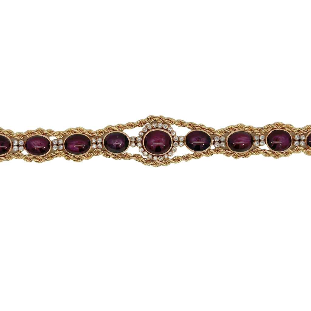 Flat view of the star ruby and diamond line bracelet showing symmetrical gemstone layout and center halo detail.