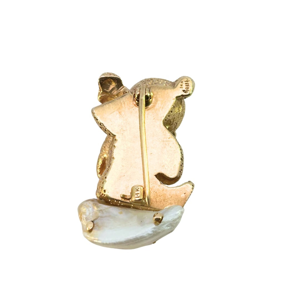 Back view showing 14k stamp, Ruser signature, and hinged pin with safety clasp.