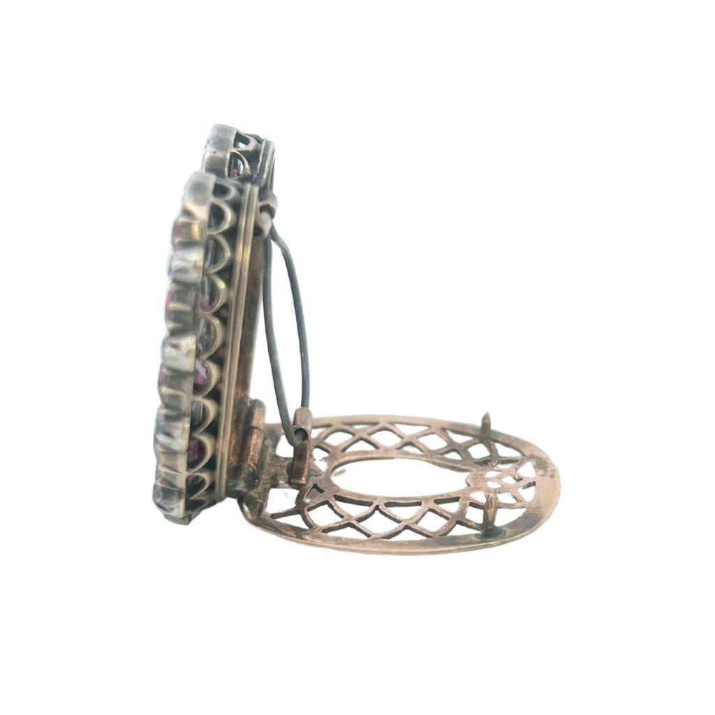 Side view showing the raised setting and silver/gold contrast of the Victorian horseshoe clip.
