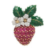 Oscar Heyman strawberry brooch with oval cabochon rubies on the gold body, diamonds on the platinum flowers, and green enamel on the leaves.
