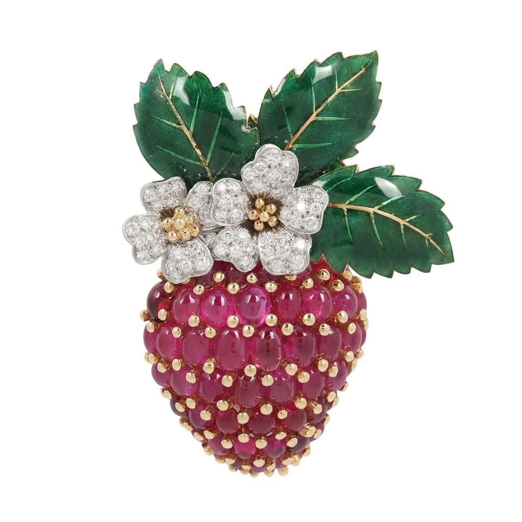 Oscar Heyman strawberry brooch with oval cabochon rubies on the gold body, diamonds on the platinum flowers, and green enamel on the leaves.